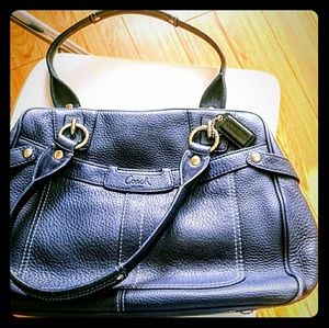 Sophisticated Coach female business hand bag